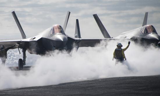 Sailors directing an F-35C Lightning II multirole fighter aircraft assigned to the “Argonauts” of Strike Fighter Squadron (VFA) 147 on the flight deck of the aircraft carrier USS Carl Vinson (CVN-70) in December 2018.